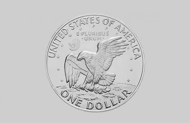 A silver coin on display with a grey background.